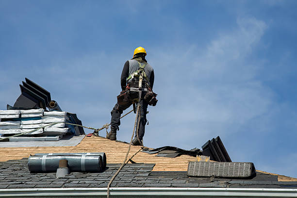 Professional Roof Replacement technician working in Breezy Point, NY